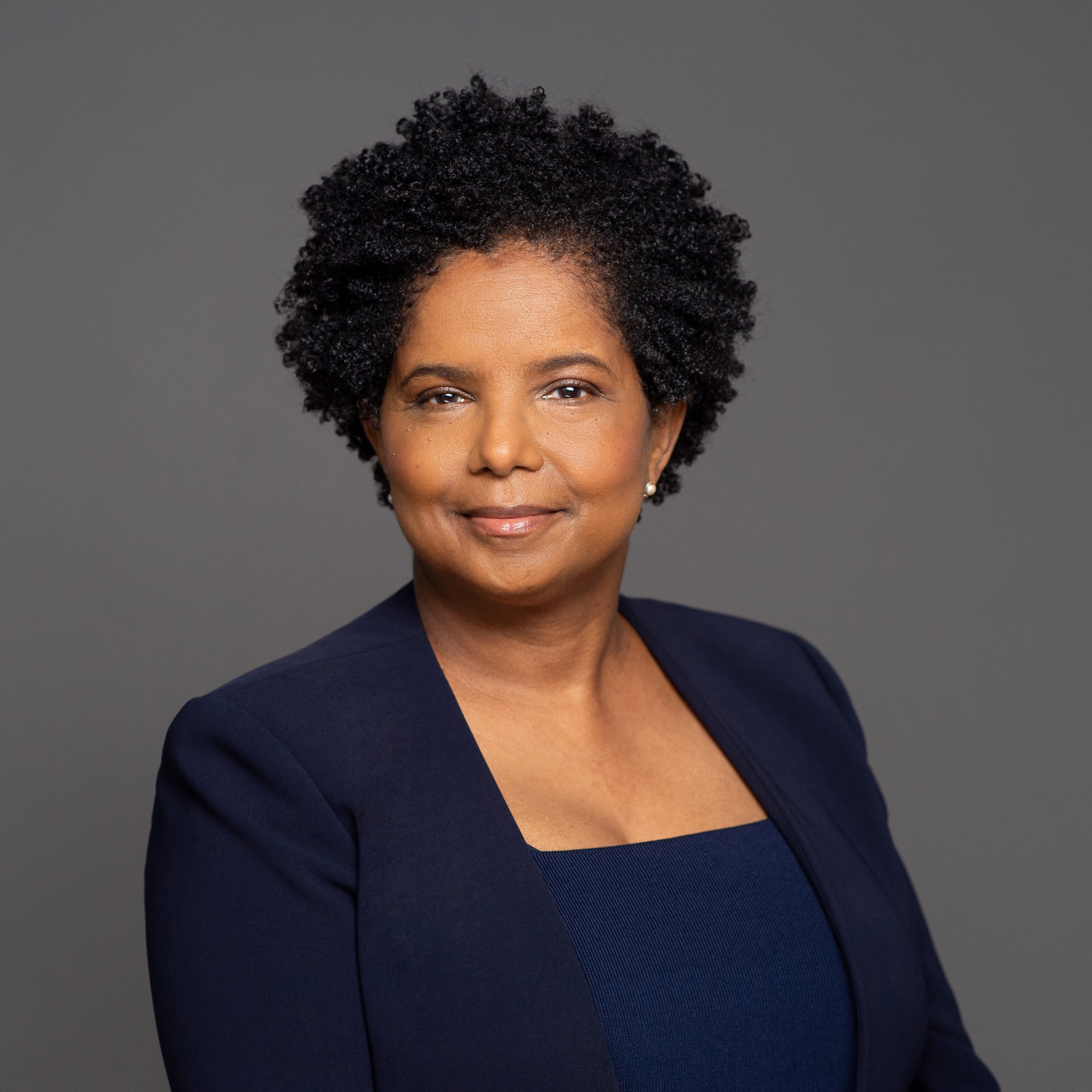 Headshot of woman in dark professional clothing