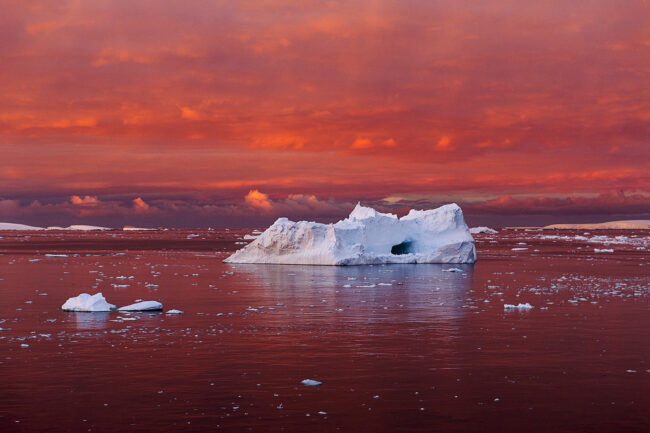 “Iceberg in Blood Red Sea, Lemaire Channel,” Antarctica, 2016. Courtesy of Camille Seaman