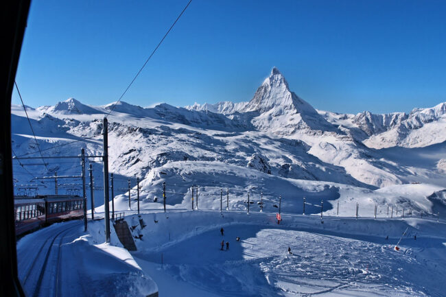 Snowy mountain top and ski railway