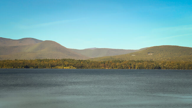 Water reservoir with hills in distance