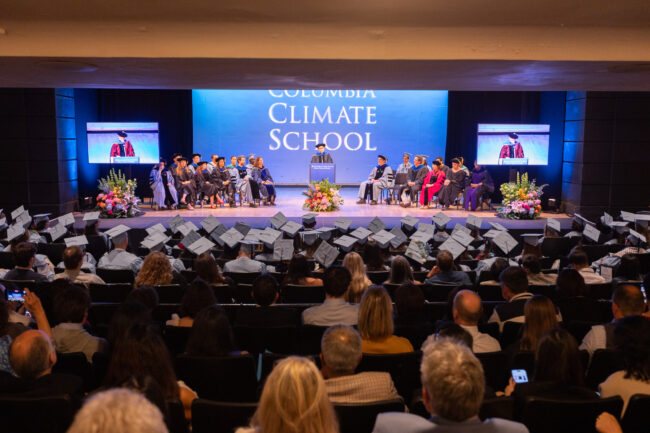 Dean speaks on stage to graduates