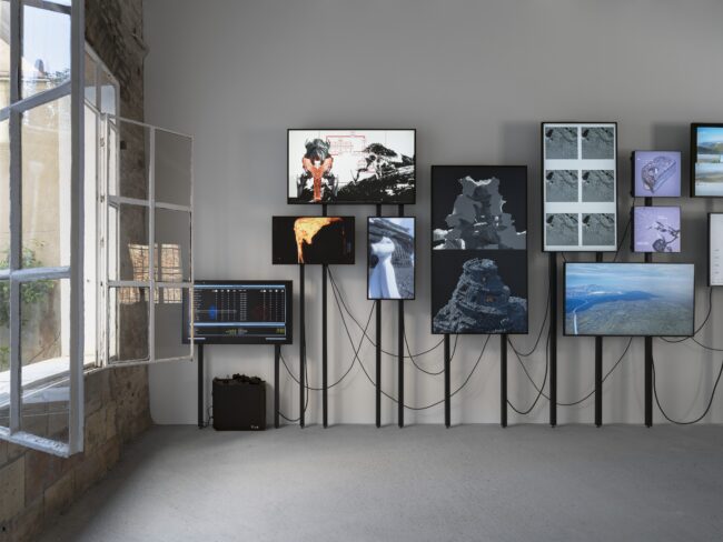 Screens with wires against a wall
