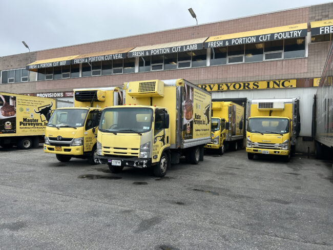 Trucks getting loaded and ready to head out for final meat distribution.