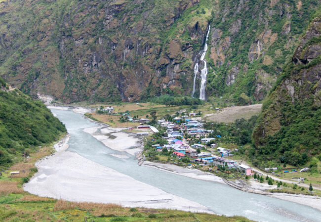 Tal village with waterfall on background